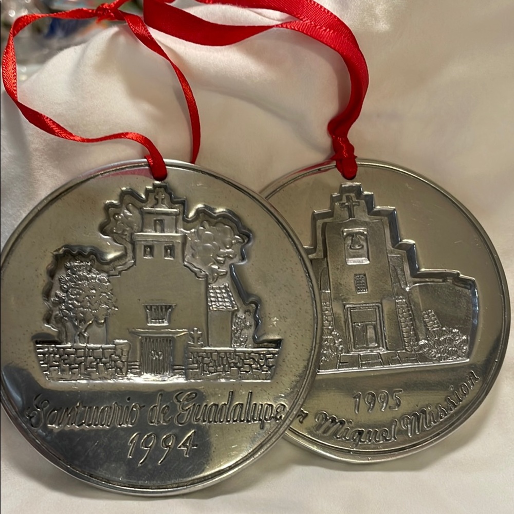 Set of two Nambe annual ornaments, 1994 and 1995